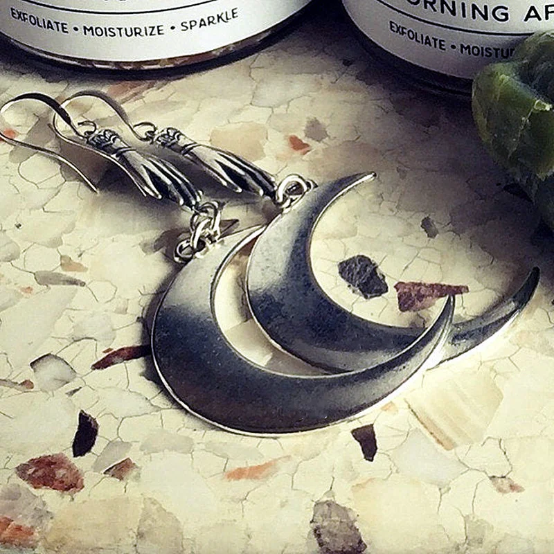 Hands Holding the Moon Earrings